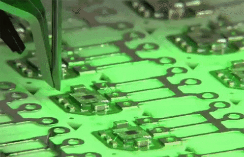 Pick and place machine populating PCB